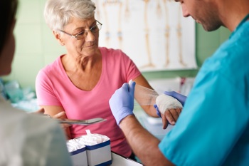 A patient receiving wound care in hospital.