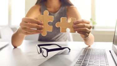 A woman sorting out a jigsaw puzzle