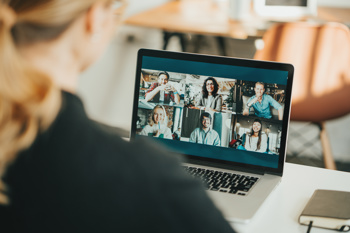 Person female having online meeting on laptop