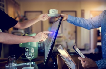 A staff taking a customers order