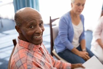 Happy care home residents after successful handover