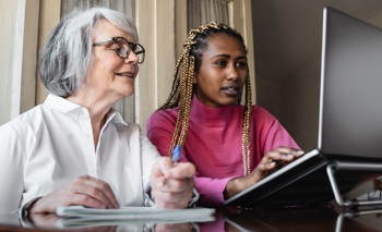 Adult social care with an older woman in the community.