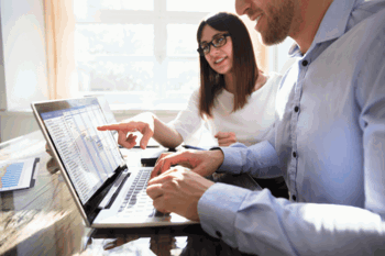 Woman and man using free production scheduling software