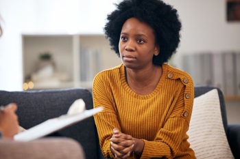 A mental health care patient talking to a clinician from a provider collaborative.