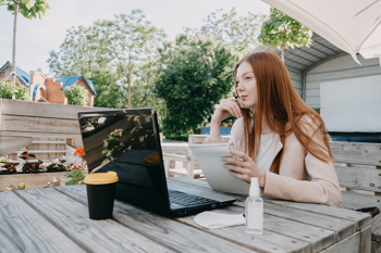 Image of a girl on her laptop lonely to show the challenges of INTs