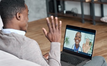 A patient talking with their doctor over a web application.