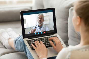 A doctor calling a patient via a video consultation.
