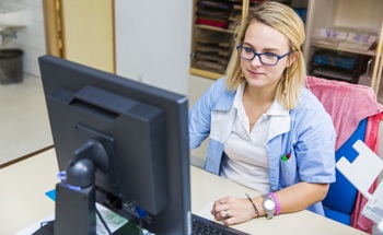 Clinical staff using healthcare data analysis software.