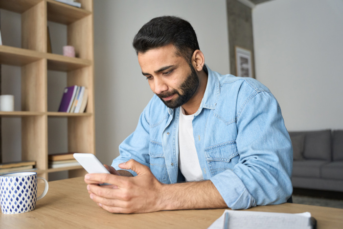 man looking at his phone