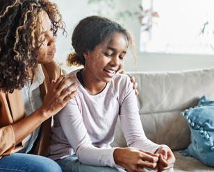 Image to show support worker helping get the voice of the child heard 