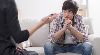 A young patient talking with a doctor.