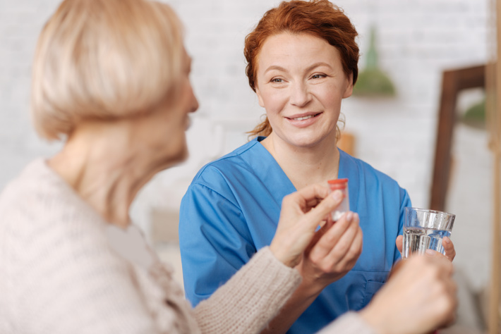 care worker handing out medication