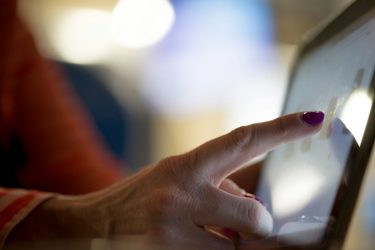 A person using a tablet.