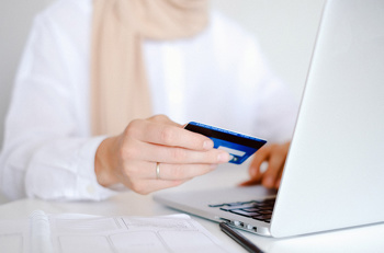 Woman purchasing something online with credit card