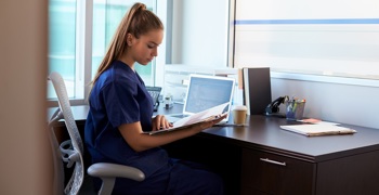 A clinician accessing electronic patient records in a hospital.