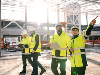 Construction workers using punch list