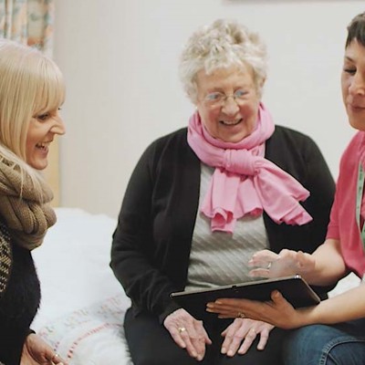 Three older woman sitting down together