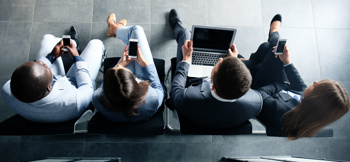 Workers sitting in a row