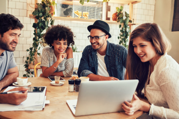 Group of people looking at a laptop