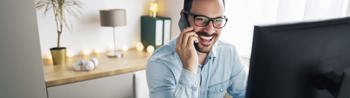 Image of an employee on a work call at home