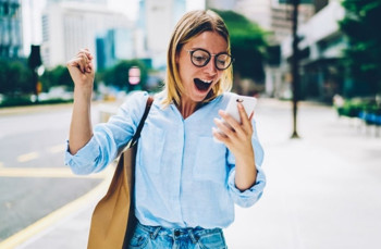Woman celebrating gamebrain win