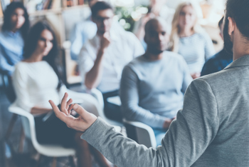 Man presenting in front of audience