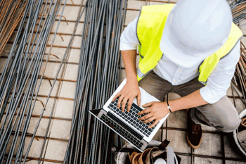 Construction worker using laptop