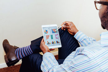 employee reward and recognition programme man using tablet