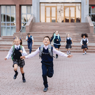 School kids running together