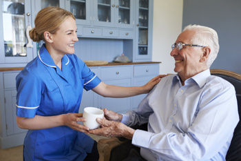 Care worker with client illustrating outstanding care