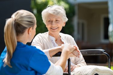 Carer performing fall risk assessment
