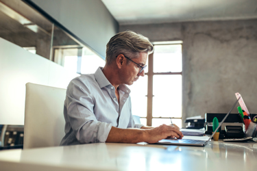 Paperless Law Firm - Man working on a laptop