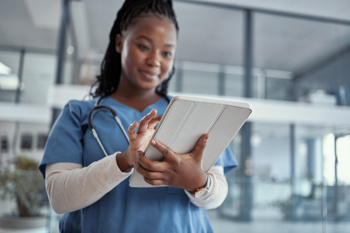 Doctor looking at a tablet