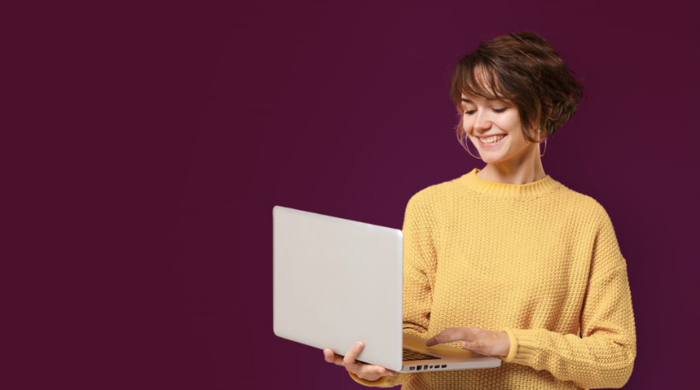 Woman With Laptop On Purple Background