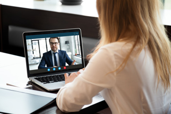 woman and man on video call meeting
