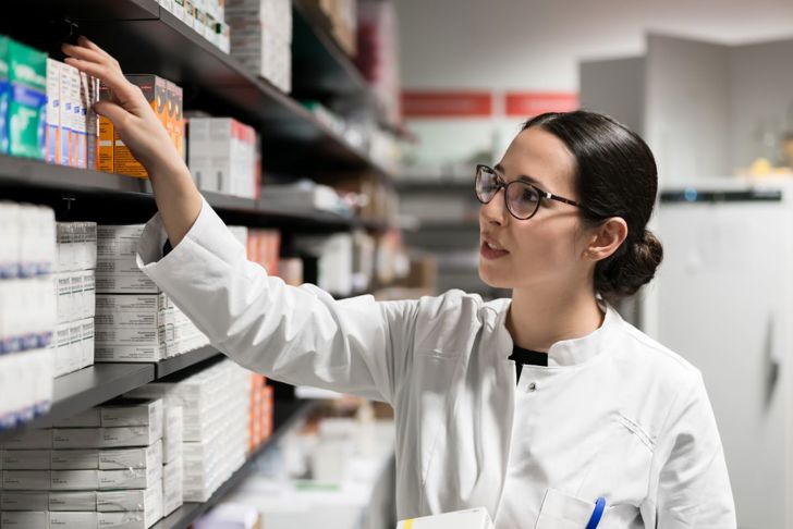 woman picking out medication