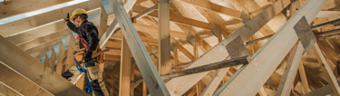 Builder constructing house
