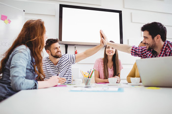 Colleagues doing a high five