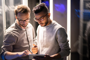 two male adults reviewing documents