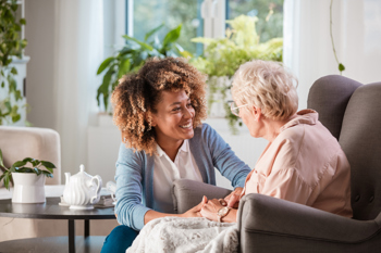 Carer and elderly lady illustrating social care values