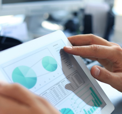 Man using iPad to look at data and analytics