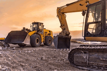 Excavator and front loader sunset