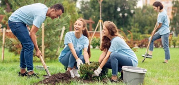 An image of a group gardening showing the importance of community engagement 